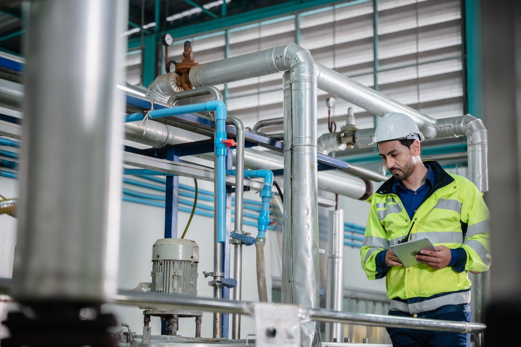 technician engineer working to maintenance a construction equipment industry